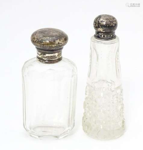 A cut glass scent/ perfume bottle with silver top …