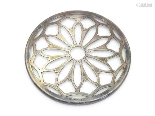 A glass coaster with silver tracery overlay hallm…