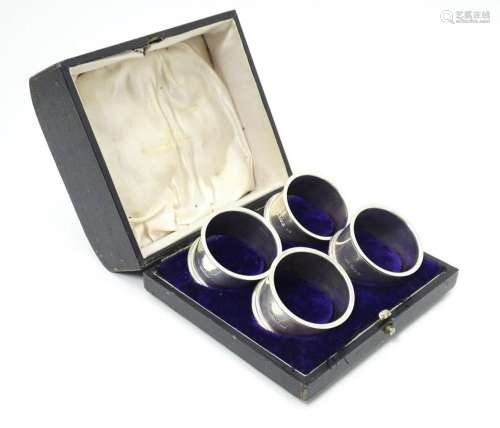 A cased set of 4 silver napkin rings hallmarked Sh…