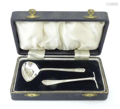 An Art Deco child's silver spoon and pusher hallma…