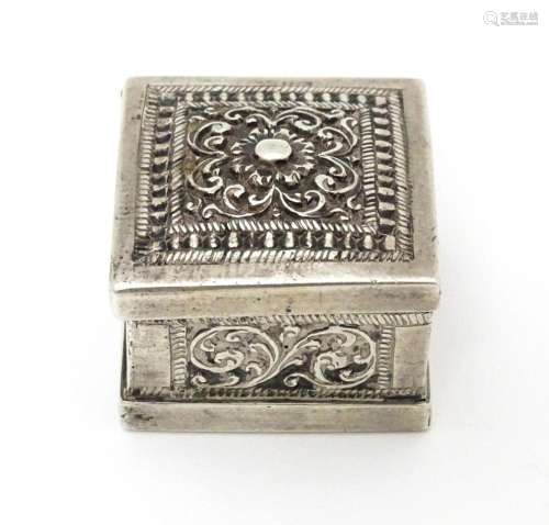 A white metal stamp box with acanthus scroll detai…