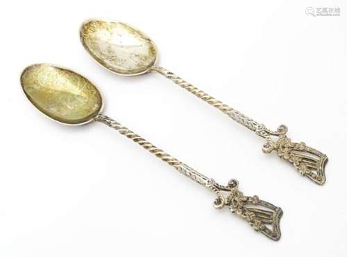 A pair of Victorian silver teaspoons the handles s…