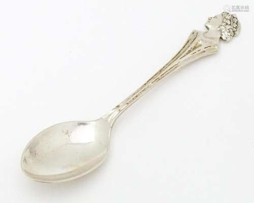 A silver commemorative / souvenir spoon the handle…