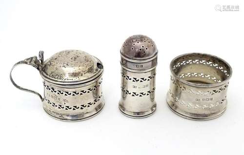 A three piece silver cruet comprising mustard pot,…