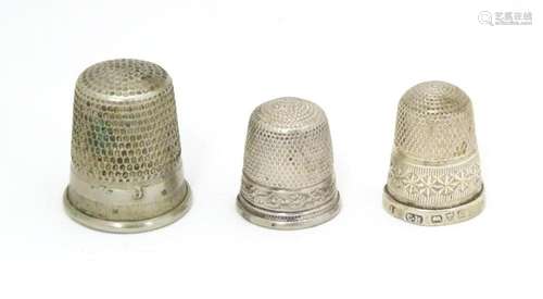 Three thimbles comprising a silver thimble hallmar…