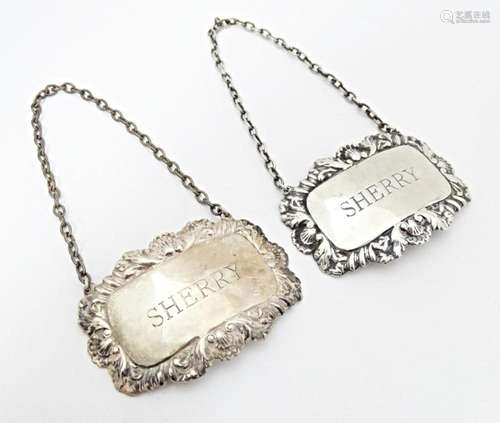 A matched pair of silver 'Sherry' decanter labels.…