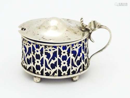 A silver mustard pot with blue glass liner. Hallma…