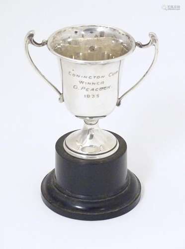 An Art Deco miniature silver twin handled trophy c…