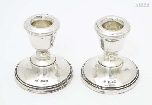 A pair of silver short candlesticks hallmarked Bir…