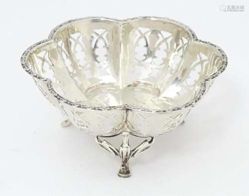 A silver bonbon dish with pierced detail and raise…