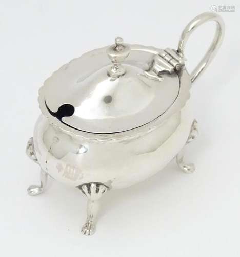 A silver mustard pot hallmarked Chester 1918 maker…