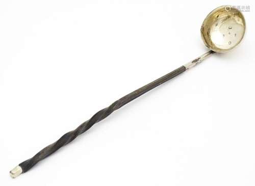 A 19thC silver toddy ladle with twist handle, hall…