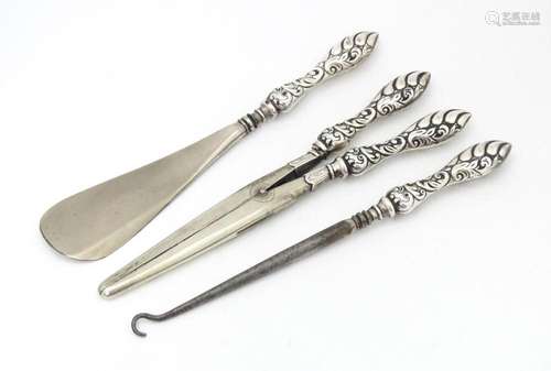 Three silver handled items comprising shoe horn, b…