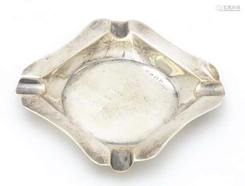 A silver ashtray hallmarked Birmingham 1928 maker…