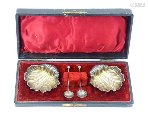 A cased pair of silver salts of scallop shell form…