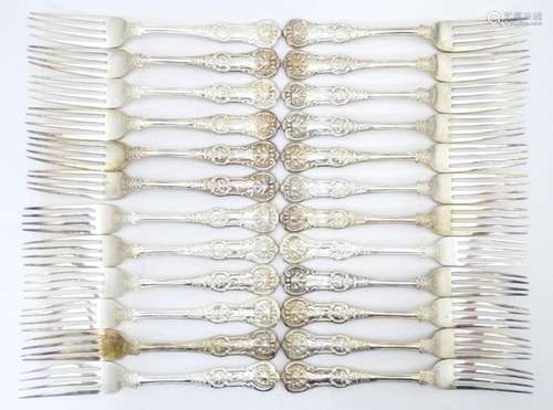 Twenty four associated Victorian silver Kings patt…