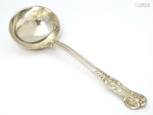 A Victorian silver Kings pattern soup ladle, hallm…