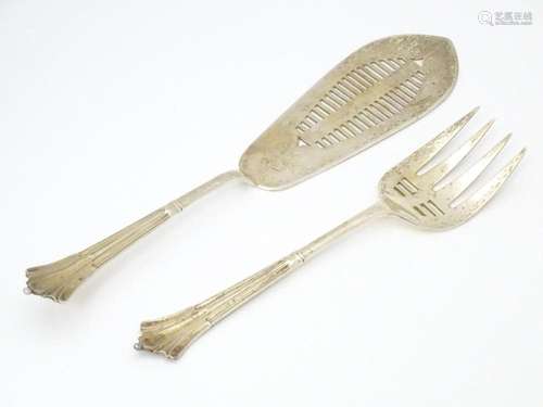 A pair of silver Albany pattern fish servers, hall…