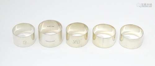 Five assorted silver napkin rings to include examp…