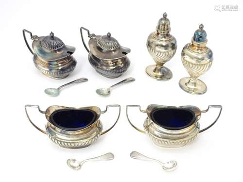 A silver plate cruet set comprising two mustard po…