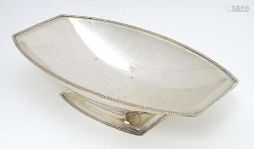 An Art Deco silver plate dish with pedestal foot. …