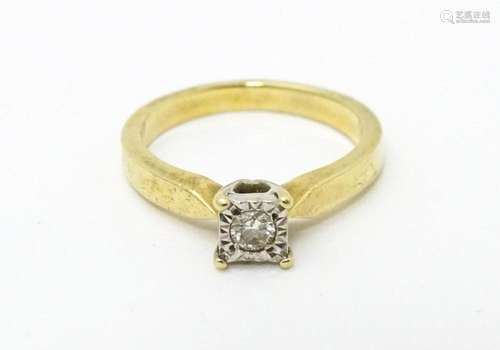 A 9ct gold ring set with central illusion set diam…