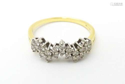 An 18ct gold ring set with a profusion of diamonds…