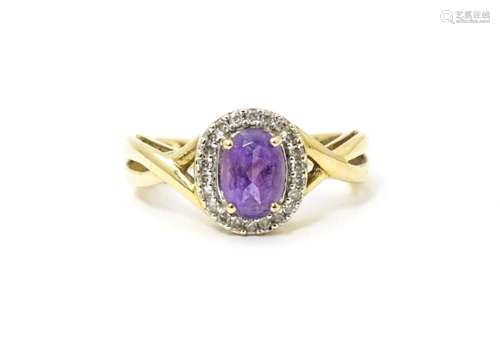 A 9ct gold ring set with amethyst and diamond. Rin…