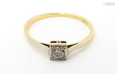 An 18ct gold ring with platinum set diamond solita…