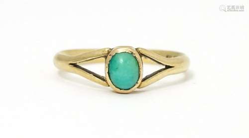 A 9ct gold ring set with turquoise cabochon. Ring …