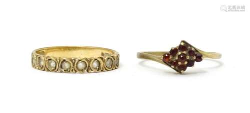 A 9ct gold ring set with garnets. Ring size approx…