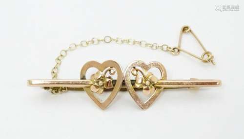 A 9ct gold Mizpah style bar brooch with heart deta…