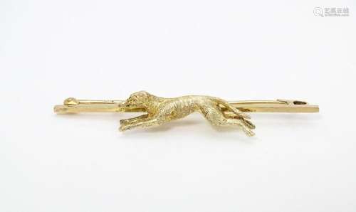 A 9ct gold bar brooch with greyhound / dog detail.…