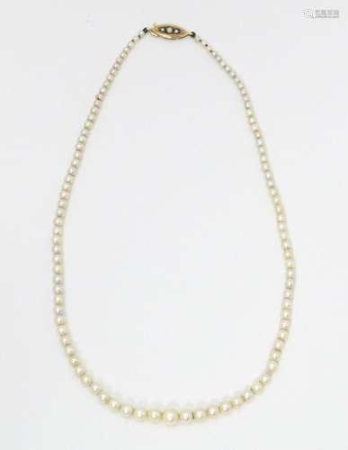 A graduated pearl necklace with 9ct gold clasp. Ap…