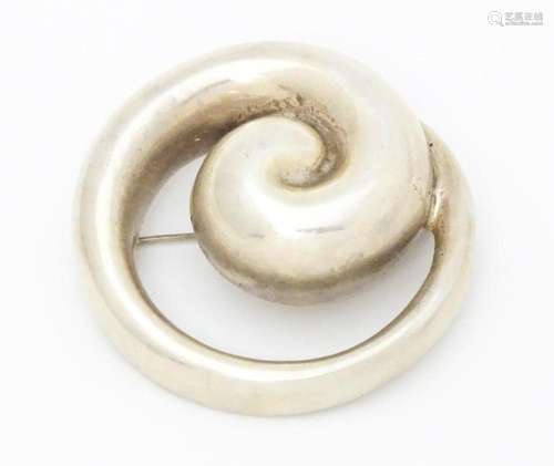 A Bayanihan modernist silver brooch of swirl form.…