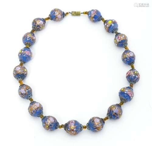 A necklace of Venetian style glass beads. Approx. …