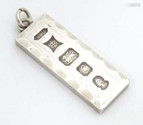 A silver pendant of ingot form hallmarked Birmingh…