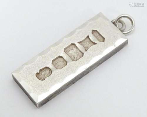 A silver pendant of ingot form hallmarked Birmingh…