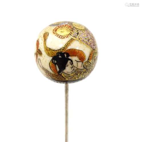 A hat pin surmounted by a Japanese satsuma cabocho…