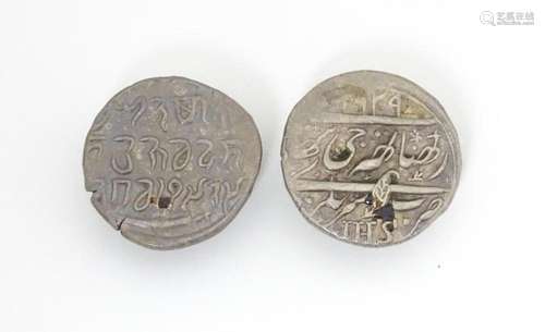 Two studs formed from Indian style coins, possibly…