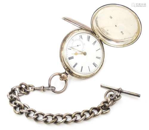 A Victorian silver hunter pocket watch, the white …