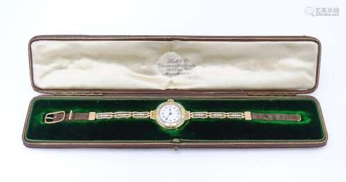 An 18ct gold cased ladies wristwatch set with 12 d…