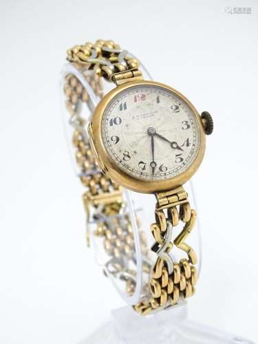 A c.1925 9ct gold cast ladies wristwatch, the dial…