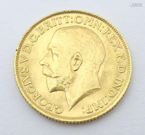 Coin: A George V 1912 gold sovereign coin. Total w…