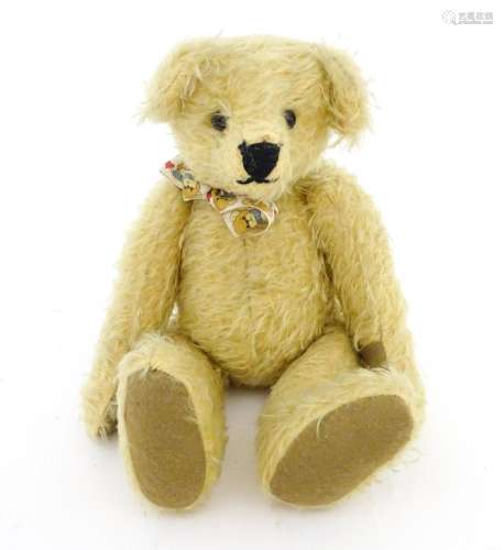 Toy: A 20thC mohair teddy bear with stitched nose …