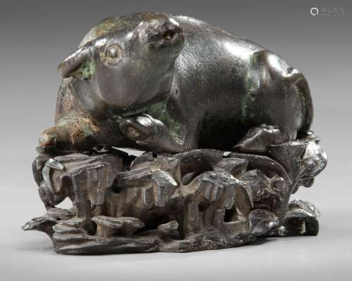 A CHINESE BRONZE BUFFALO ON A STAND, MING DYNASTY (1368-1644...
