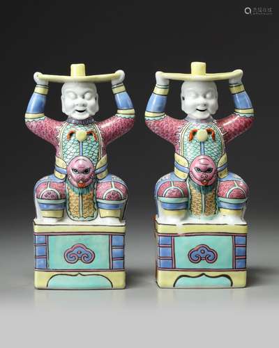 A PAIR OF CHINESE FAMILLE ROSE FOREIGNER CANDLESTICKS, 19TH ...