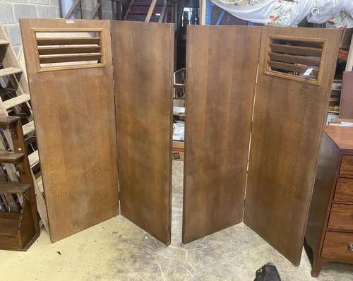 A pair of mid century oak two-fold dressing screens, with Bo...