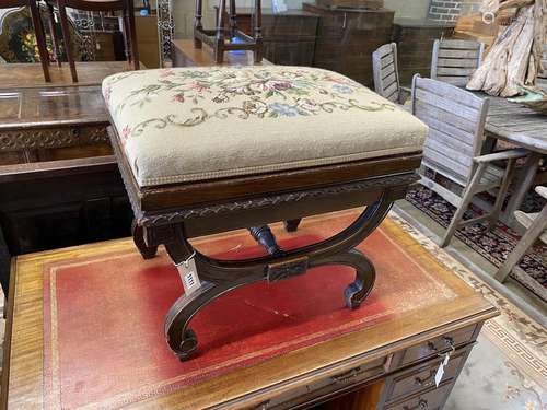 An early 20th century Regency style mahogany X frame dressin...