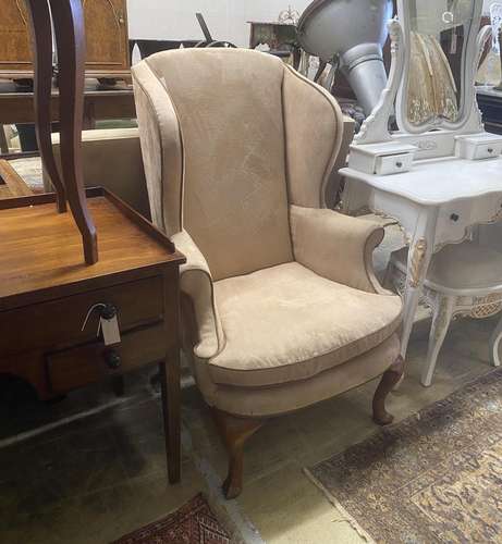 A George I style wing armchair upholstered in faux suede fab...